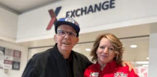 A veteran poses in the Exchange mall with an Exchange associate.